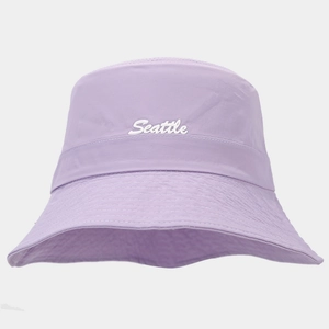 Detail of lavender quick-dry bucket hat featuring white Seattle 3D embroidery on front