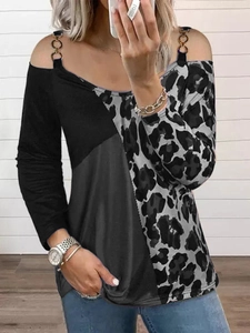 Detail of cold shoulder top with leopard print stitching and gold chain strap decoration
