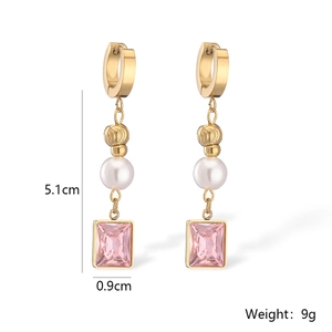 Macro view of gold-plated earrings with pearls and pink gems showing dimensions 5.1cm