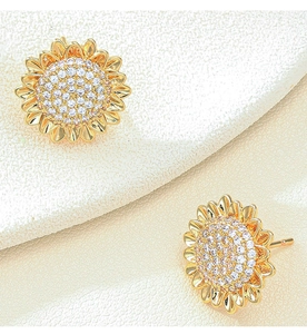 Detail of sunflower stud earrings with gold finish and sparkling cubic zirconia stones
