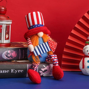 Patriotic gnome plush with red blue white American flag colors on vintage books