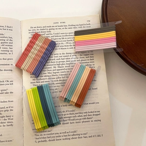 Matte candy color bobby pins set for girls on a vintage book page backdrop