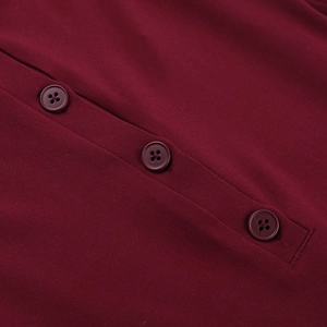 Detail of dark red knit fabric featuring three matching four-hole buttons on the neckline