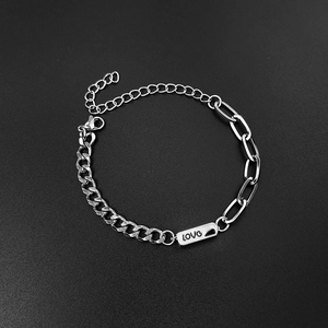 Detailed view of stainless steel couple bracelet featuring LOVE plaque and mixed chain link