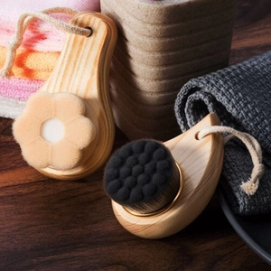 Close-up of wooden facial cleansing brushes with ultra-soft bristles and hanging cords
