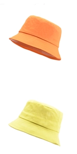 Vertical view of high-quality orange and yellow cotton bucket hats with fine stitching