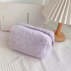 Detail of soft lavender plush cosmetic bag with matching zipper on waffle fabric