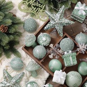 Champagne green Christmas tree ornament set with stars, balls, and festive wood decor