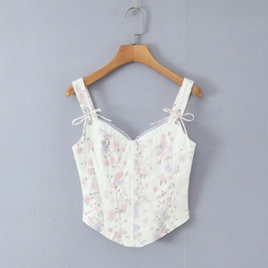 Detailed macro view of the floral print mesh texture with delicate white lace trim on the V-neck