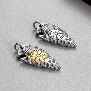 Detail of Viking arrow pendants with Vegvisir compass symbols in silver and gold steel