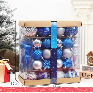 Blue and silver Christmas ball ornaments in a gift box, detail view of diverse textures