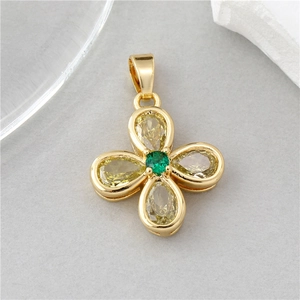 Elegant gold flower pendant featuring a green center gem and light yellow crystal petals