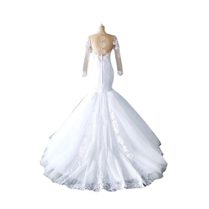 Elegant white mermaid bridal gown featuring long lace sleeves and a delicate open back design