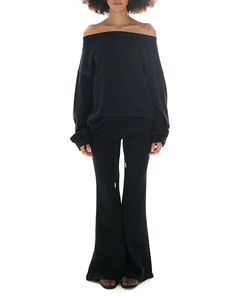 Detail view of black off-shoulder long sleeve sweatshirt and flared sweatpants set for women