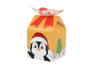 Detailed view of Christmas gift box with penguin motif and red ribbon decoration