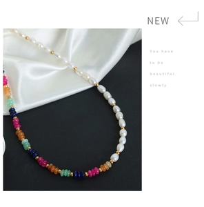 Detail of baroque freshwater pearls and multi-color natural stone beaded necklace