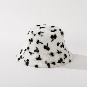 Detail showing plush faux fur texture and black cherry print on white bucket hat