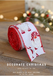 Detail of Christmas ribbon with festive gnome prints and red glitter edges on wood