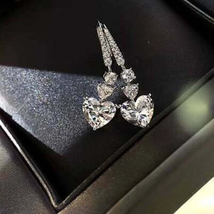 Elegant heart-shaped drop earrings in silver-plated copper with sparkling zircon stones