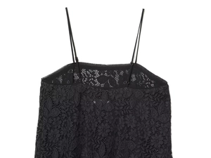 Close-up of intricate floral lace texture and adjustable slim straps on black camisole