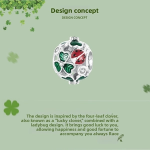 Close-up of S925 silver lucky clover charm with red ladybug and green enamel details