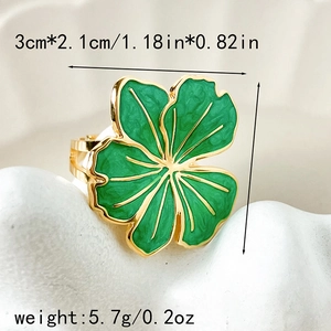 Vintage gold-plated stainless steel ring with a green enamel four-leaf clover design