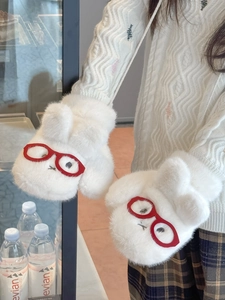 Close-up of white plush mittens with cute bunny face and red glasses embroidery