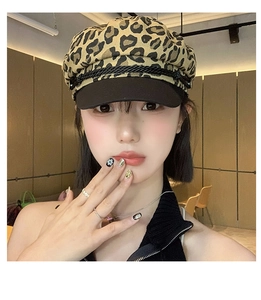 Detailed close-up of y2k leopard print octagonal baker boy hat with black brim and trim