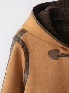 Detail of camel faux suede jacket featuring warm dark brown plush lining and leather trims