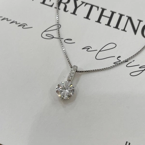 Minimalist silver necklace with a brilliant round zircon pendant on a thin box chain