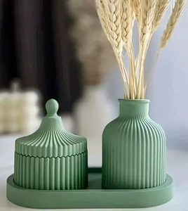 Detailed view of Morandi green ceramic vase and storage jar set with pleated texture
