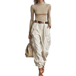 Full view of wide-leg cargo pants with high waist and brown leather belt detail