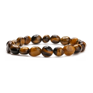 Macro view of irregular tiger eye stone beads showing silk luster and golden brown texture
