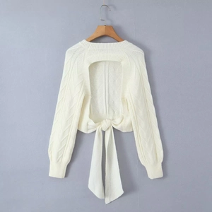 White cable knit cropped sweater with backless cutout design and bow tie detail