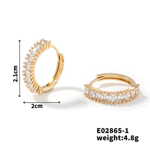 Detailed view of gold hoop earrings with clear cubic zirconia inlay and 2.1cm dimensions