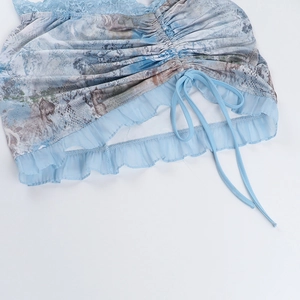 Detail of light blue lace trim and drawstring adjustment on the slim-fit bodice top