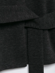 Close-up detail of dark grey soft fabric texture with a waist belt and fine stitching
