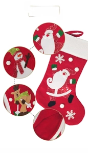 Detail of red Christmas stockings with Santa embroidery, sequins and plush white trim