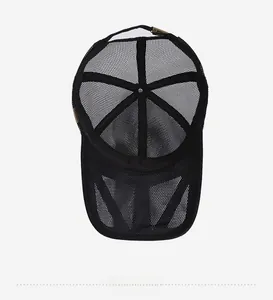 Detail showing the breathable black mesh interior and metal adjustment buckle of the mesh cap