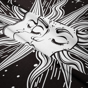 Close-up of bohemian sun and moon tapestry showing soft polyester fabric texture and drape
