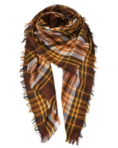Detail of soft plaid scarf with fringe in brown orange and yellow woven fabric