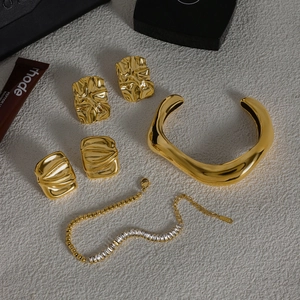 Luxury gold jewelry set with tiger eye open bangle, stylish earrings and chain bracelet