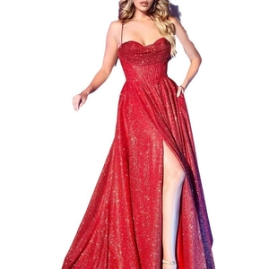 Detail of red sequined floor-length evening dress featuring a high side slit and thin straps