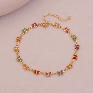 Detail of gold ankle chain with colorful butterfly charms and adjustable lobster clasp
