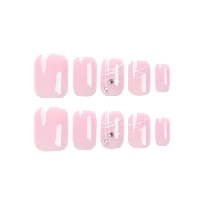 Short French press-on nails in cherry blossom pink with rhinestones and white accents