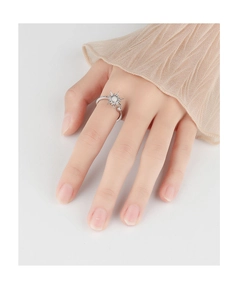 Close-up of rotatable sunflower ring with a central opal stone and adjustable band