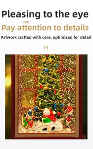 Close-up of a red Christmas phone booth music box with a snowman and a decorated tree