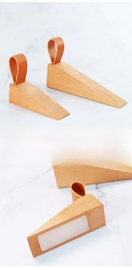 Detail of beech wood door stopper with leather strap and anti-slip silicone base pad