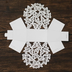 Detailed flat layout of white butterfly laser-cut paper candy box showing folding lines