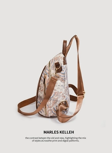 Detailed side view of the retro wave pattern backpack with brown leather handle and gold hardware